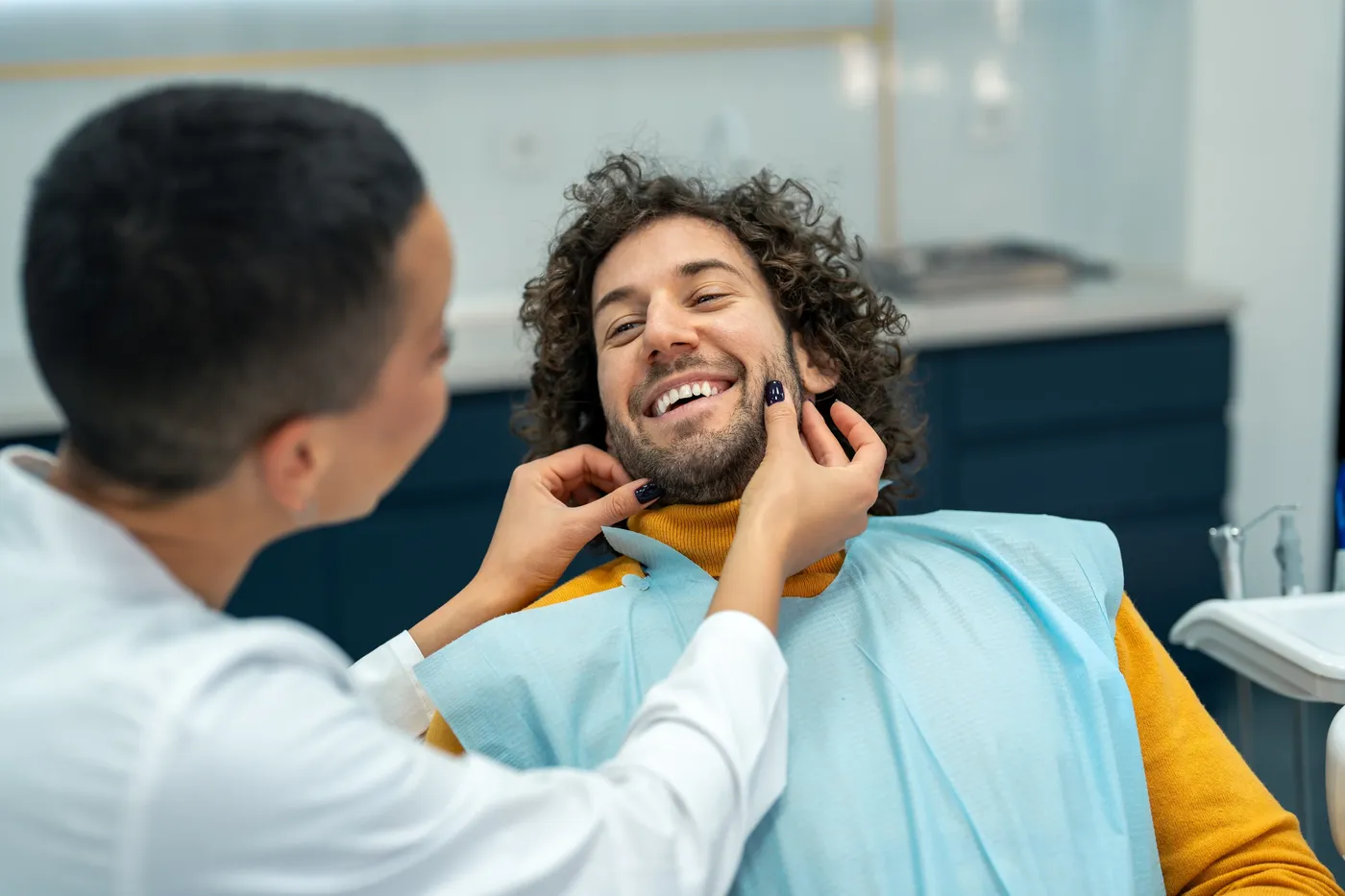 Smiling patient in dental chair at Indian Trace Dental