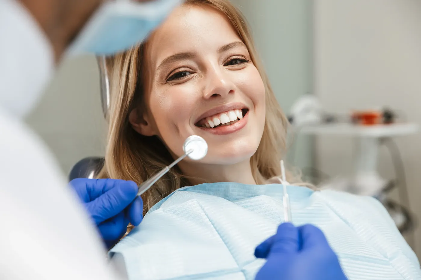 Patient smiling during a cosmetic dentistry procedure