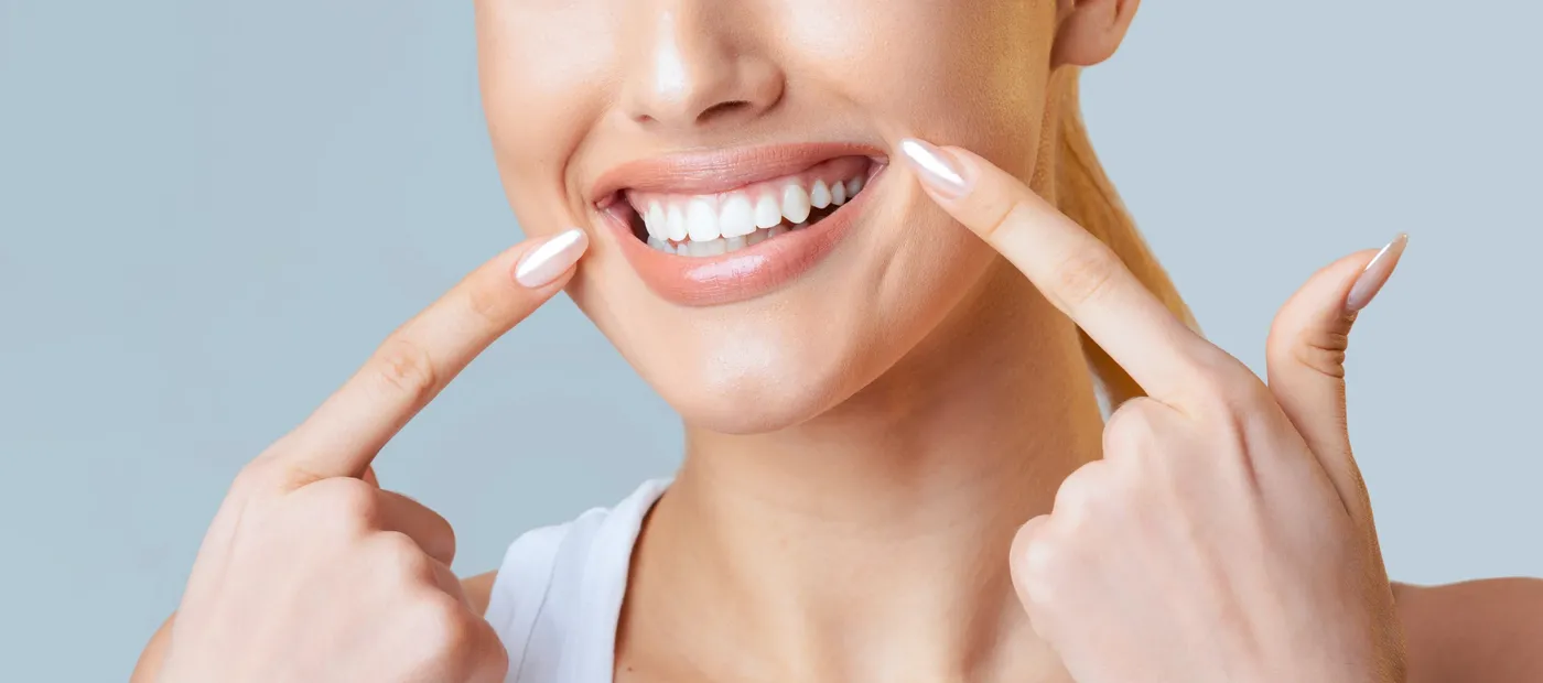 Patient showing restored smile after restorative dentistry