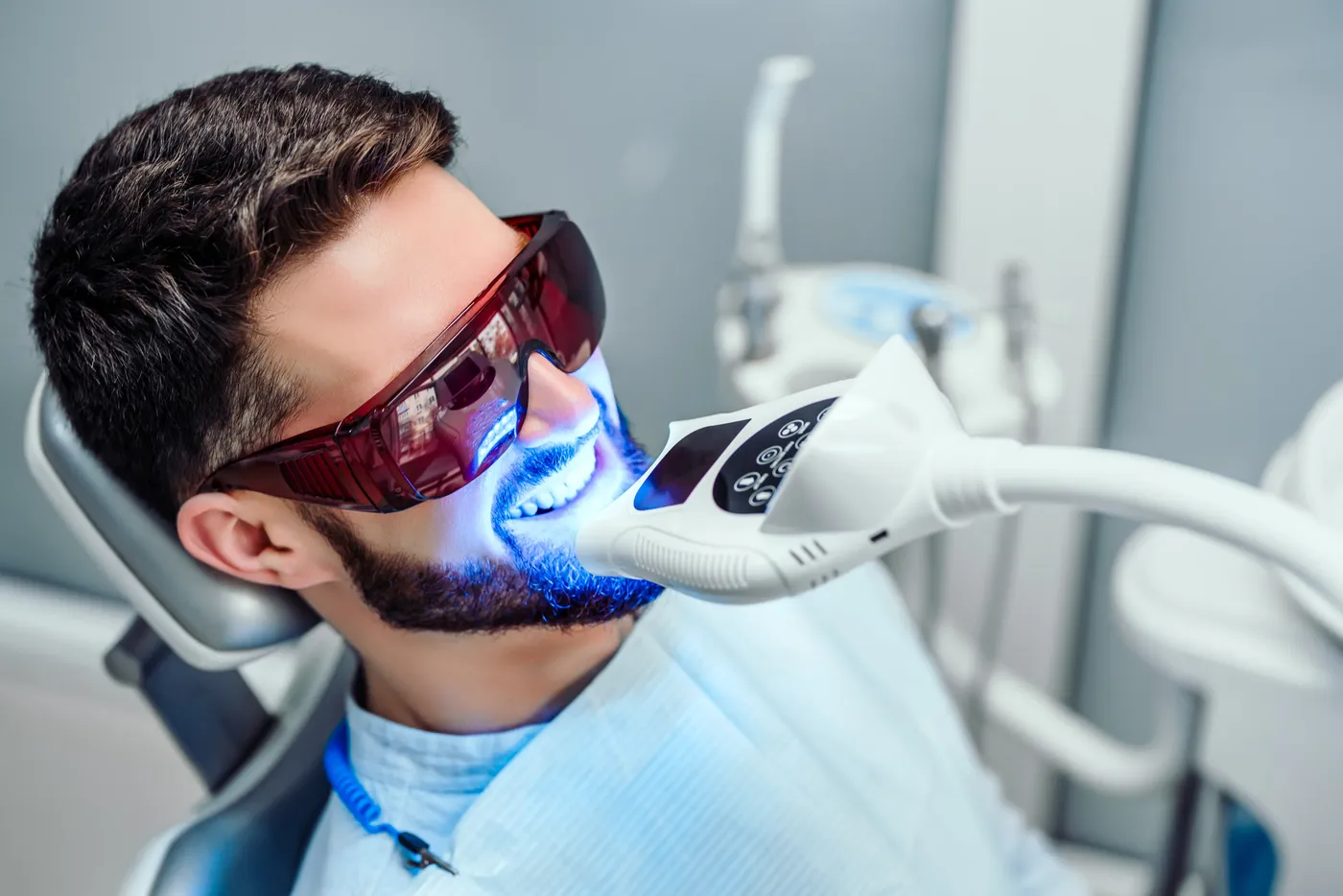 Professional in-office teeth whitening with LED light at Indian Trace Dental